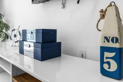 a white table with blue boxes and a no sign on it at Brickell Nights, Icon Lights 1BR Luxe Stay in Miami