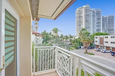a balcony with a view of the city at Massive waterfront home with pool in North Miami Beach