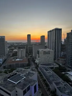 a view of a city skyline at sunset at Luxury Downtown Miami Stay in Upscale Building in Miami