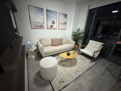 a living room with a couch and a table at Luxury Downtown Miami Stay in Upscale Building in Miami