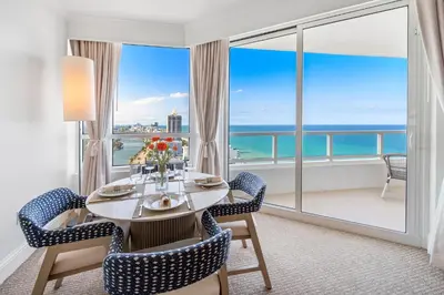 a dining room with a view of the ocean at Ocean View Private Residence at Fontainebleau -3505 in Miami Beach