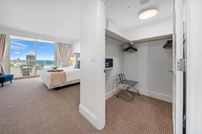 a bedroom with a bed and a view of the ocean at Ocean View Private Residence at Fontainebleau -3505 in Miami Beach