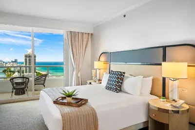a hotel room with a bed and a view of the ocean at Ocean View Private Residence at Fontainebleau -3505 in Miami Beach