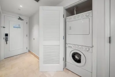 a white laundry room with a washer and dryer at Ocean View Private Residence at Fontainebleau -3505 in Miami Beach