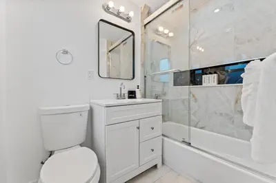 a bathroom with a toilet and a sink and a shower at Family Splash Escape in Fort Lauderdale