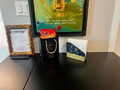 a table with a box of popcorn and a poster at The Art Studio Downtown in Miami