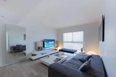 a living room with a couch and a table at Beach Haus Key Biscayne Contemporary Apartments in Miami