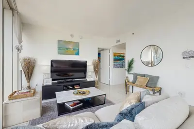 a living room with a couch and a tv at Tony Ultimate Experience Miami in Miami