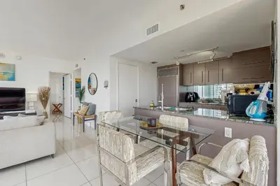 a kitchen and living room with a table and chairs at Tony Ultimate Experience Miami in Miami