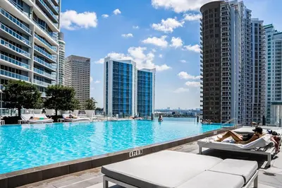 a swimming pool on the roof of a building with buildings at Tony Ultimate Experience Miami in Miami