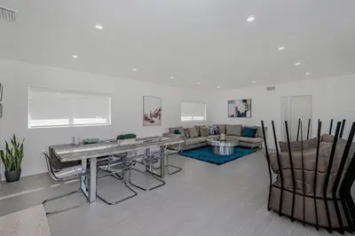 a living room with a table and chairs and a couch at Stylish Apartment at Brickell ,Free Parking in Miami
