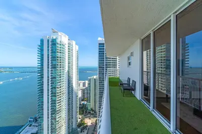 a balcony of a building with a view of the water at City-View Retreat in Brickell 2BR and Free Parking in Miami