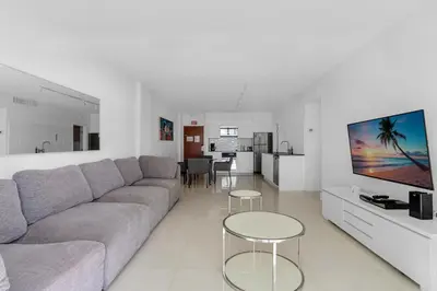 a living room with a couch and a tv at Komffy Apartment with 2 King Beds OceanView at Tides in Hollywood