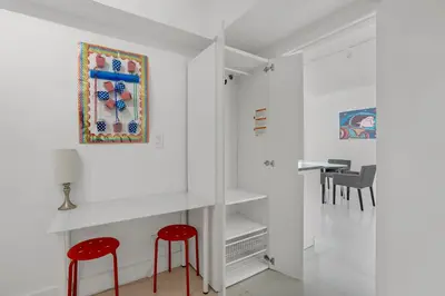 a white room with two red stools and a table at Komffy Apartment with 2 King Beds OceanView at Tides in Hollywood