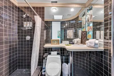 a bathroom with a sink and a toilet in it at Wonderful Tropical Pool House Miami Coconut Grove in Miami