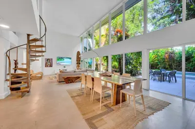 a large living room with a table and chairs at Wonderful Tropical Pool House Miami Coconut Grove in Miami