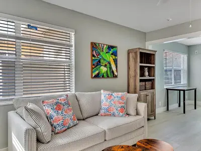 a living room with a couch and a table at Dania Beach 1BR | Views + WiFi + Parking in Dania Beach