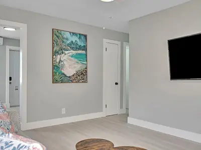 a living room with a tv and a couch at Dania Beach 1BR | Views + WiFi + Parking in Dania Beach
