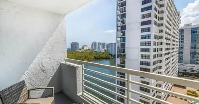 a balcony with a view of a river and buildings at Modern Condo by the Beach, Water Taxi Stop, Prime Location! in Fort Lauderdale