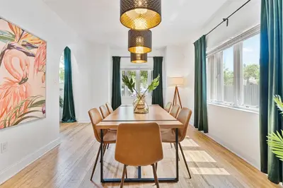 a dining room with a table and chairs at Havana Oh Na Na Unit A in Miami