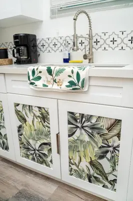 a kitchen with a sink with tropical wallpaper at Havana Oh Na Na Unit C in Miami