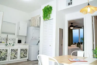 a kitchen and dining room with a table and chairs at Havana Oh Na Na Unit C in Miami