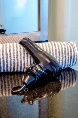 a hair dryer sitting on a table at Penthouse with Private Rooftop in Miami Beach