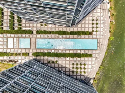 an overhead view of a building with a pool at Luxury Unit 1 Bed W Residences Brickell in Miami