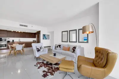 a living room with a couch and chairs and a table at Luxury Unit 1 Bed W Residences Brickell in Miami