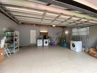a large room with three washing machines in it at 2 Bedroom Cozy House Near Barry University in Miami