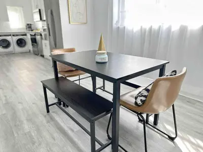 a black table with two chairs and a lamp on it at Center Miami Designer Home 3 BR sleeps 9 in Miami