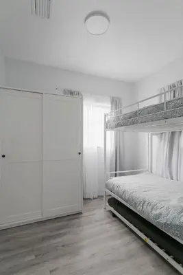 a white bedroom with a bunk bed and a closet at Center Miami Designer Home 3 BR sleeps 9 in Miami
