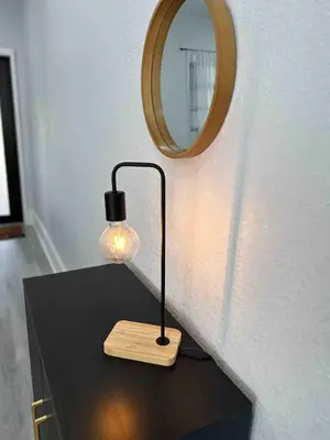 a table with a lamp and a mirror on a wall at Center Miami Designer Home 3 BR sleeps 9 in Miami