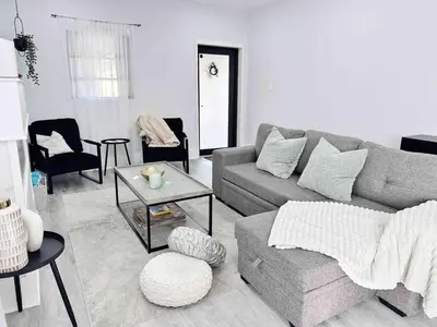 a living room with a couch and a table at Center Miami Designer Home 3 BR sleeps 9 in Miami