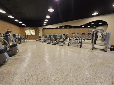 a gym with rows of treadmills and machines at Shine Suites Balcony Duplex 5 in Miami Beach