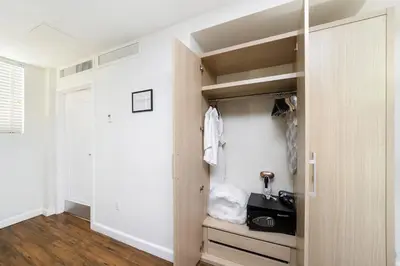 a room with a closet with a door open at Villa Italia by At Mine Hospitality in Miami Beach