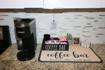 a coffee bar sign sitting on top of a counter at Charming 3BR Getaway - Central Miami Location in Miami