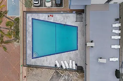an overhead view of a swimming pool on a building at Charming Beachside Studio - Steps to the Beach in Hollywood