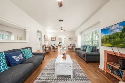 a living room with a couch and a tv at Hollywood Beach Bliss Villa Sleeps 10 in Hollywood