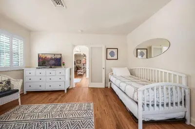 a bedroom with a white bed and a white dresser at Hollywood Beach Bliss Villa Sleeps 10 in Hollywood