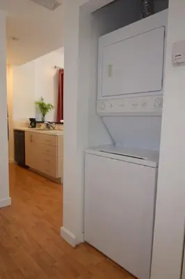 a kitchen with a white refrigerator in a room at Light-Filled Apt Steps to Beach Convention Center in Miami Beach