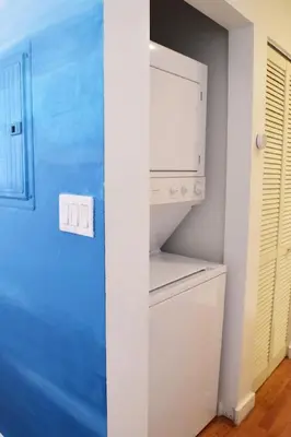 a kitchen with a white refrigerator and a microwave at Light-Filled Apt Steps to Beach Convention Center in Miami Beach