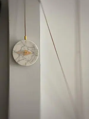 aendant light hanging from a wall with a white door at Right on the Beach Ocean Dr Secured Condo 206 in Miami Beach