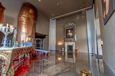 a room with a fireplace and a painting on the wall at W Hotel 2BR Ocean View, Pool, Spa, Free Gym Classes in Miami