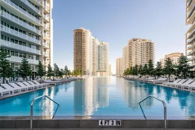 a large swimming pool in a city with buildings at Wrap around Bay View, W Hotel Luxury 2BR 2BA, Pool, Spa, Free Gym Classes in Miami