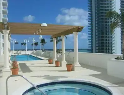 a swimming pool on the roof of a building at Top Stay Miami Gold Brickell in Miami