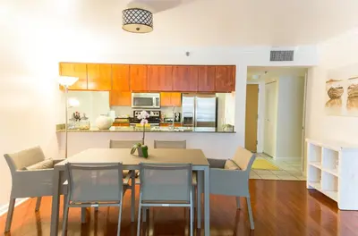 a kitchen and dining room with a table and chairs at Top Stay Miami Gold Brickell in Miami