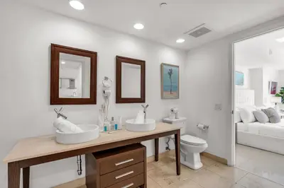 a bathroom with two sinks and a toilet at Icon Brickell Retreat 1BR and Spa, Pool, Views in Miami