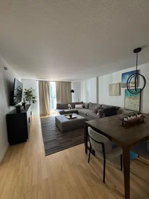 a living room with a couch and a table at Elegant 1BR Condo at Brickell in Miami