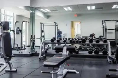 a gym with a lot of equipment in a room at Cozy 2BR Apt at Brickell free parking in Miami